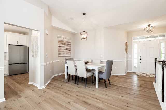 26615 W Captiva Ln, Plainfield, IL 60544 - dining space with a chandelier, light wood-type flooring, baseboards, and lofted ceiling