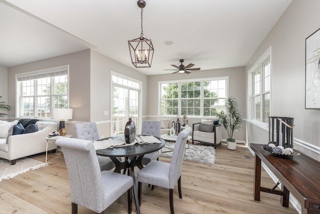 26615 W Captiva Ln, Plainfield, IL 60544 - dining area with light wood-style floors, ceiling fan, a chandelier, and baseboards