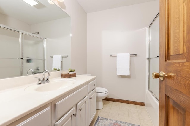 1101 Sterling Glen Cc Ct, Normal, IL 61761 - full bath featuring vanity, toilet, tile patterned flooring, baseboards, and shower / bath combination with glass door
