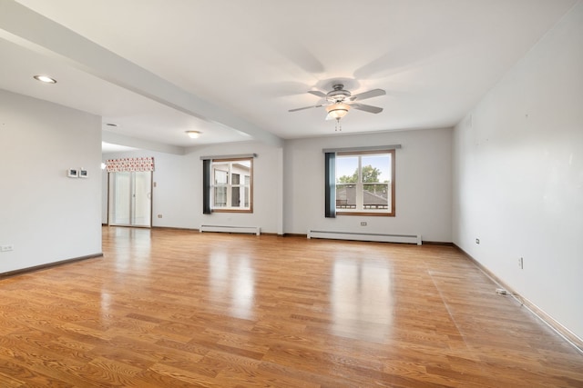 13116 Woodland Dr, Homer Glen, IL 60491 - spare room with a baseboard heating unit, baseboard heating, a ceiling fan, light wood-type flooring, and recessed lighting