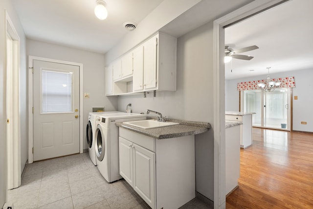 13116 Woodland Dr, Homer Glen, IL 60491 - laundry room with washing machine and dryer, a ceiling fan, cabinet space, a chandelier, and light tile patterned floors