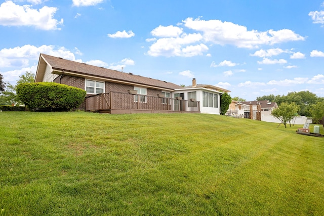13116 Woodland Dr, Homer Glen, IL 60491 - rear view of house featuring a deck, a yard, brick siding, and a chimney