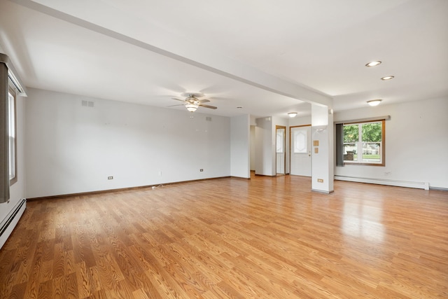 13116 Woodland Dr, Homer Glen, IL 60491 - unfurnished living room with baseboard heating, light wood-style flooring, a ceiling fan, a baseboard heating unit, and recessed lighting