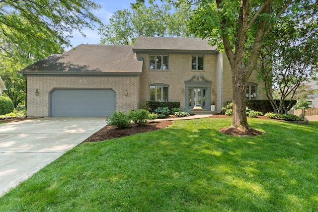 2731 Wolf River Ct, Naperville, IL 60565 - colonial house featuring an attached garage, driveway, brick siding, and a front yard