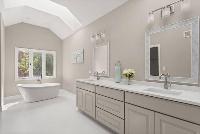 2731 Wolf River Ct, Naperville, IL 60565 - full bathroom featuring a skylight, double vanity, a freestanding bath, vaulted ceiling, and baseboards