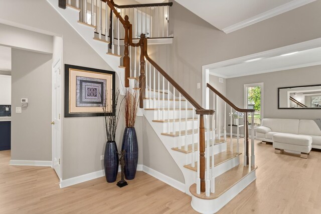 2731 Wolf River Ct, Naperville, IL 60565 - stairs featuring wood finished floors, ornamental molding, and baseboards