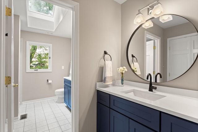 2731 Wolf River Ct, Naperville, IL 60565 - full bath featuring vanity, a skylight, toilet, baseboards, and tile patterned floors