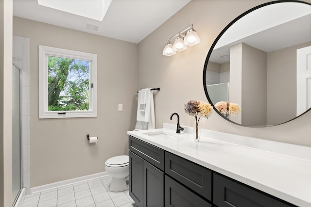 2731 Wolf River Ct, Naperville, IL 60565 - full bathroom featuring a skylight, vanity, baseboards, toilet, and tile patterned floors