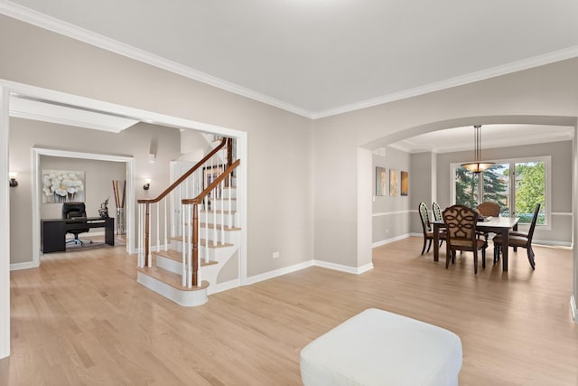 2731 Wolf River Ct, Naperville, IL 60565 - living room with arched walkways, light wood-type flooring, ornamental molding, baseboards, and stairs