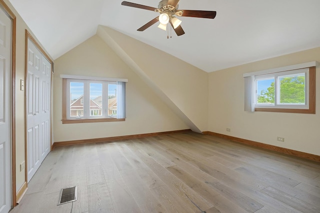 5531 S Mcvicker Ave, Chicago, IL 60638 - additional living space with light wood-style floors, vaulted ceiling, ceiling fan, and baseboards