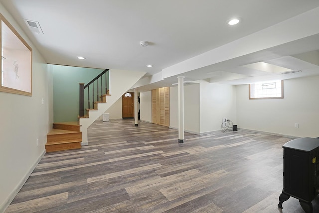 5531 S Mcvicker Ave, Chicago, IL 60638 - basement with wood finished floors, stairs, baseboards, and recessed lighting