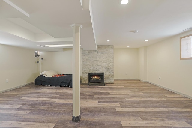 5531 S Mcvicker Ave, Chicago, IL 60638 - finished basement with wood finished floors, a fireplace, baseboards, and recessed lighting