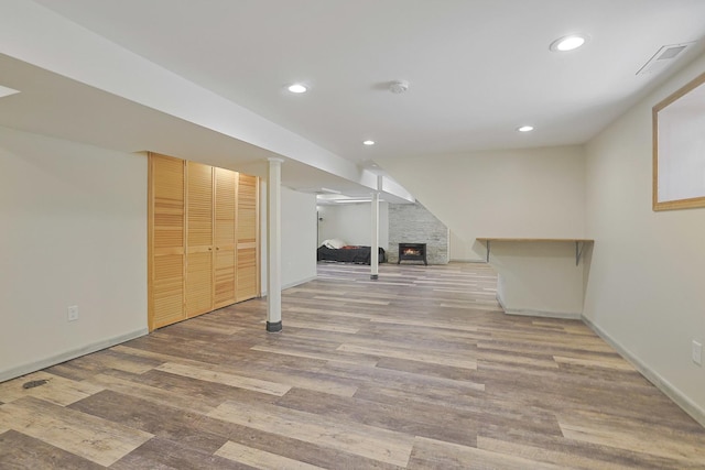 5531 S Mcvicker Ave, Chicago, IL 60638 - finished basement featuring wood finished floors, recessed lighting, baseboards, and a warm lit fireplace