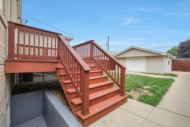 5531 S Mcvicker Ave, Chicago, IL 60638 - deck featuring stairs, a detached garage, and an outbuilding