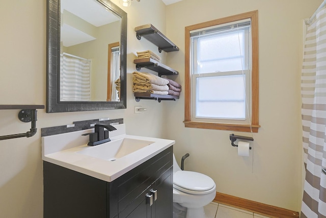 5531 S Mcvicker Ave, Chicago, IL 60638 - bathroom with vanity, toilet, tile patterned floors, baseboards, and a shower with curtain