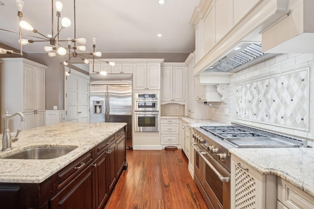 3926 N Greenview Ave, Chicago, IL 60613 - kitchen with a sink, stainless steel appliances, premium range hood, white cabinets, and recessed lighting