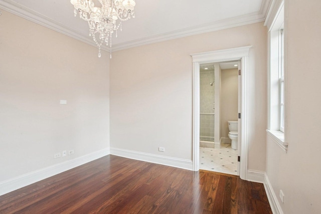 3926 N Greenview Ave, Chicago, IL 60613 - empty room featuring a chandelier, ornamental molding, baseboards, and wood finished floors