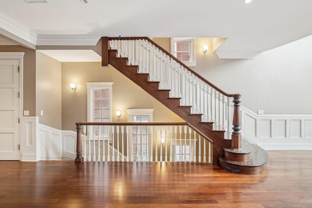 3926 N Greenview Ave, Chicago, IL 60613 - stairway with wood finished floors, a decorative wall, a wainscoted wall, and ornamental molding