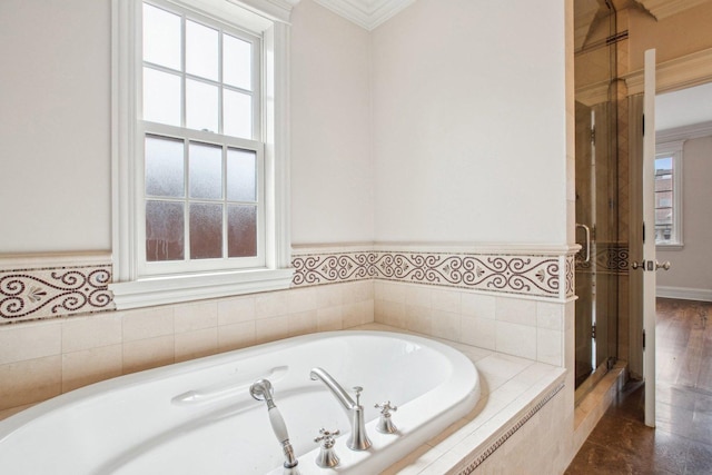 3926 N Greenview Ave, Chicago, IL 60613 - bathroom featuring a bath, ornamental molding, and a shower stall