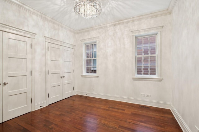 3926 N Greenview Ave, Chicago, IL 60613 - unfurnished bedroom with wood finished floors, a chandelier, baseboards, and crown molding