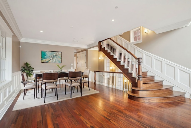 3926 N Greenview Ave, Chicago, IL 60613 - dining space with stairs, wood finished floors, ornamental molding, a decorative wall, and wainscoting