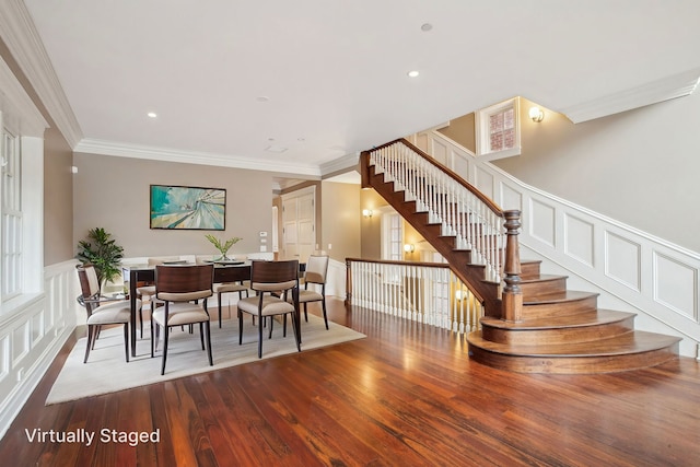 3926 N Greenview Ave, Chicago, IL 60613 - dining area featuring stairway, ornamental molding, a decorative wall, wood finished floors, and a wainscoted wall