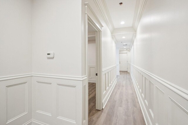 3926 N Greenview Ave, Chicago, IL 60613 - hallway with a decorative wall, crown molding, wainscoting, light wood-style floors, and recessed lighting