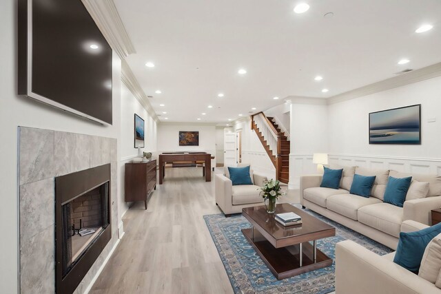 3926 N Greenview Ave, Chicago, IL 60613 - living room with ornamental molding, stairway, recessed lighting, light wood-type flooring, and a wainscoted wall