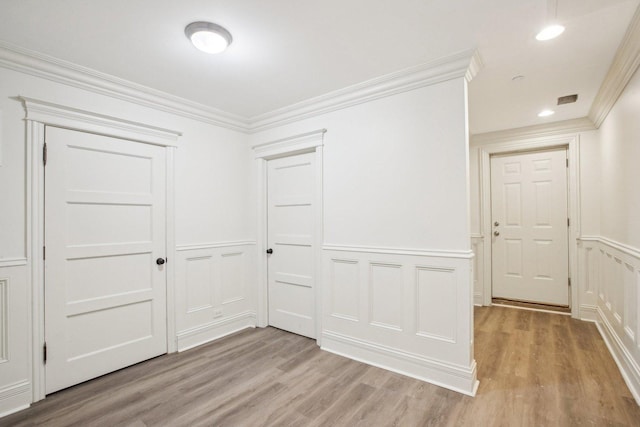 3926 N Greenview Ave, Chicago, IL 60613 - hall with a decorative wall, light wood-style flooring, wainscoting, crown molding, and recessed lighting