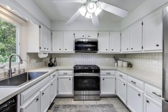 14828 W N Creek Ct, Homer Glen, IL 60491 - kitchen featuring stainless steel microwave, range with gas cooktop, light tile patterned floors, black dishwasher, and ceiling fan
