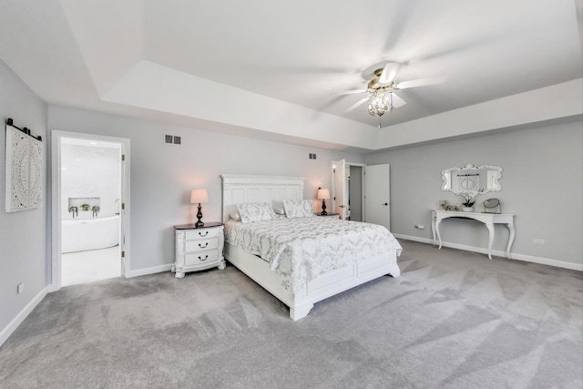 14828 W N Creek Ct, Homer Glen, IL 60491 - bedroom featuring a tray ceiling, light colored carpet, and ceiling fan