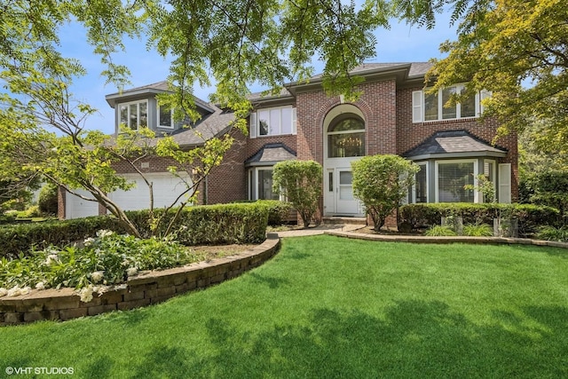 4332 Camelot Cir, Naperville, IL 60564 - traditional-style house featuring brick siding, an attached garage, and a front yard