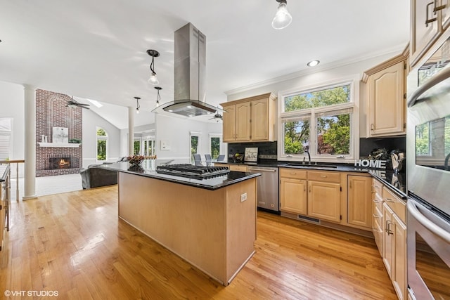 4332 Camelot Cir, Naperville, IL 60564 - kitchen featuring a ceiling fan, appliances with stainless steel finishes, island range hood, light brown cabinetry, and lofted ceiling