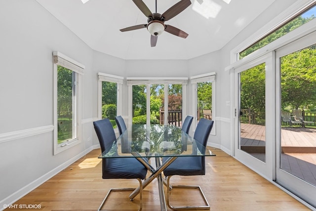 4332 Camelot Cir, Naperville, IL 60564 - sunroom / solarium with a wooden deck, a skylight, high vaulted ceiling, and wood finished floors