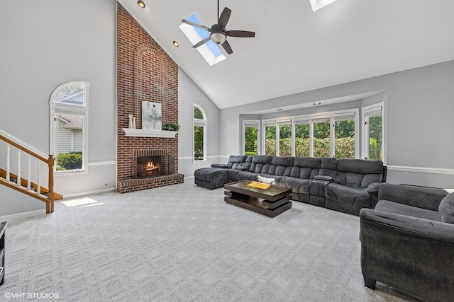 4332 Camelot Cir, Naperville, IL 60564 - living area with a skylight, high vaulted ceiling, ceiling fan, a fireplace, and stairway