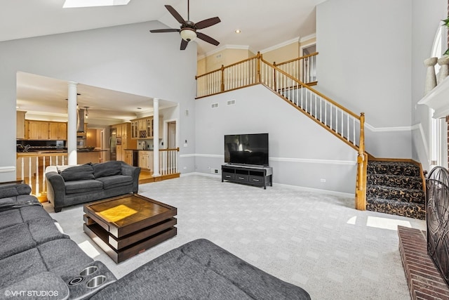 4332 Camelot Cir, Naperville, IL 60564 - living area with high vaulted ceiling, stairs, ceiling fan, baseboards, and carpet