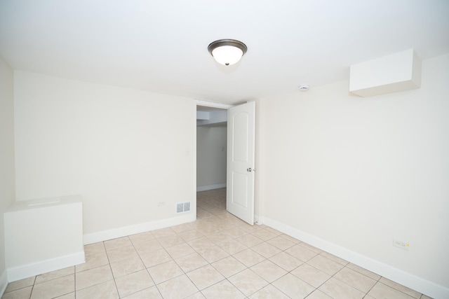 2440 Oak Park Ave, Berwyn, IL 60402 - empty room featuring light tile patterned flooring and baseboards