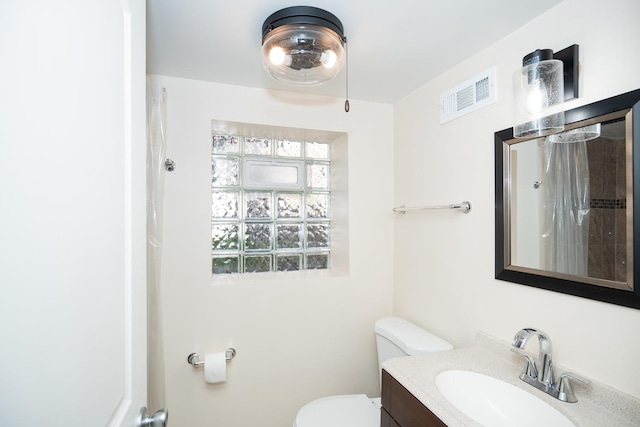 2440 Oak Park Ave, Berwyn, IL 60402 - bathroom with a shower with curtain, toilet, and vanity