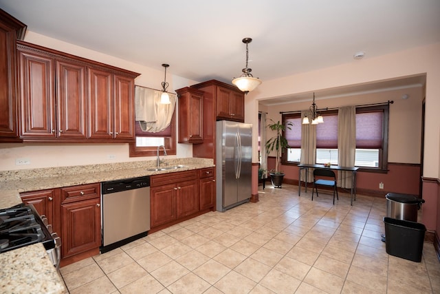 2440 Oak Park Ave, Berwyn, IL 60402 - kitchen featuring appliances with stainless steel finishes, a sink, light tile patterned flooring, hanging light fixtures, and a chandelier