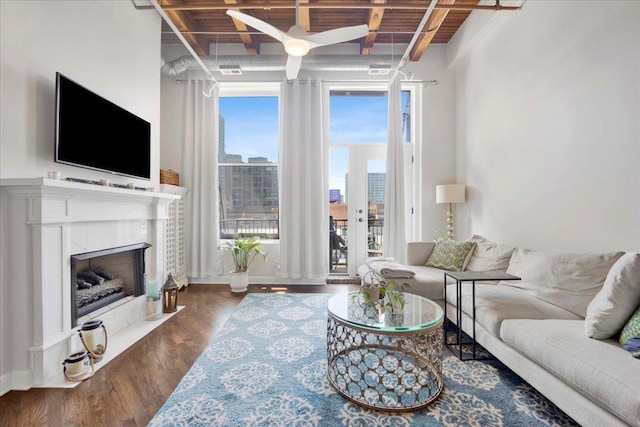 616 W Fulton St Unit 212, Chicago, IL 60661 - living room featuring wood finished floors, a fireplace, wooden ceiling with exposed beams, and a view of city