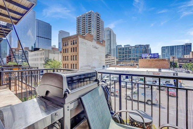 616 W Fulton St Unit 212, Chicago, IL 60661 - balcony featuring a view of city and a grill