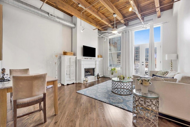 616 W Fulton St Unit 212, Chicago, IL 60661 - living area featuring wood finished floors, wood ceiling with exposed beams, and a fireplace