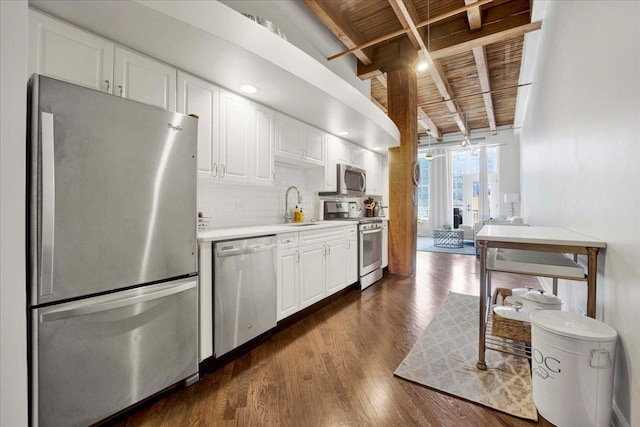 616 W Fulton St Unit 212, Chicago, IL 60661 - kitchen with stainless steel appliances, wooden ceiling with exposed beams, a sink, light countertops, and backsplash