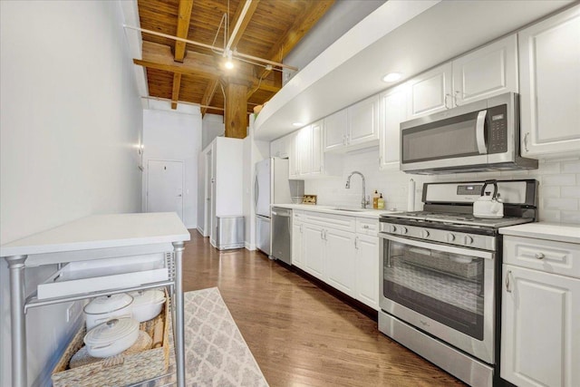 616 W Fulton St Unit 212, Chicago, IL 60661 - kitchen with stainless steel appliances, a sink, wood ceiling, decorative backsplash, and white cabinetry