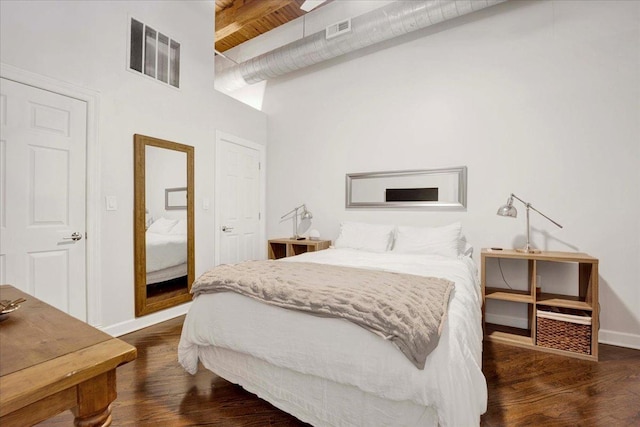 616 W Fulton St Unit 212, Chicago, IL 60661 - bedroom with wood finished floors, a towering ceiling, baseboards, and beam ceiling