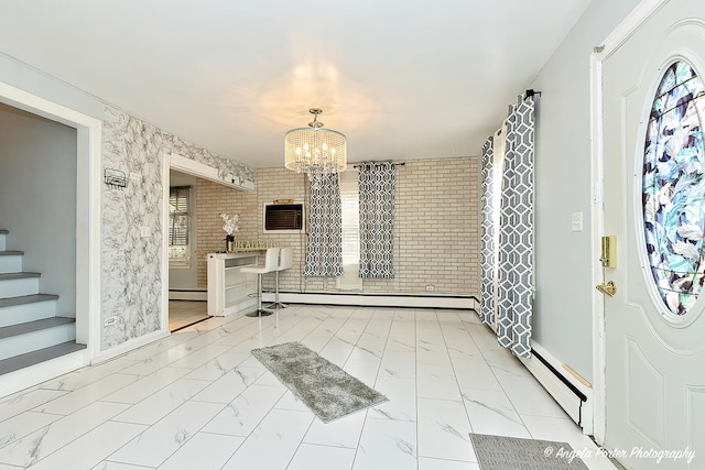 617 Colville Pl, Waukegan, IL 60087 - foyer entrance featuring a chandelier, a baseboard radiator, plenty of natural light, and marble look tile flooring