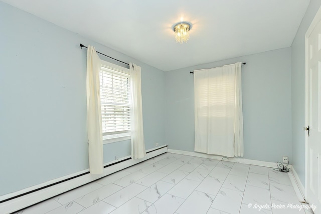 617 Colville Pl, Waukegan, IL 60087 - spare room featuring a baseboard radiator, light marble finish floors, and baseboards