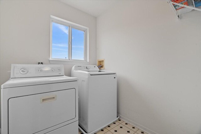 32526 Pilgrims Ct, Lakemoor, IL 60051 - laundry area with washer and clothes dryer and baseboards