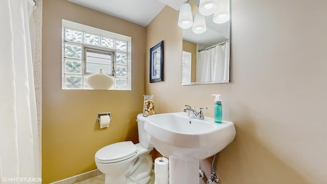 16101 Wabash Ave, South Holland, IL 60473 - full bathroom with toilet, baseboards, and a shower with shower curtain