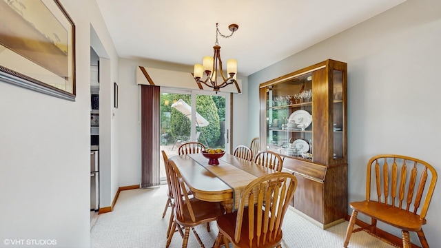 16101 Wabash Ave, South Holland, IL 60473 - dining area with a chandelier, light carpet, and baseboards